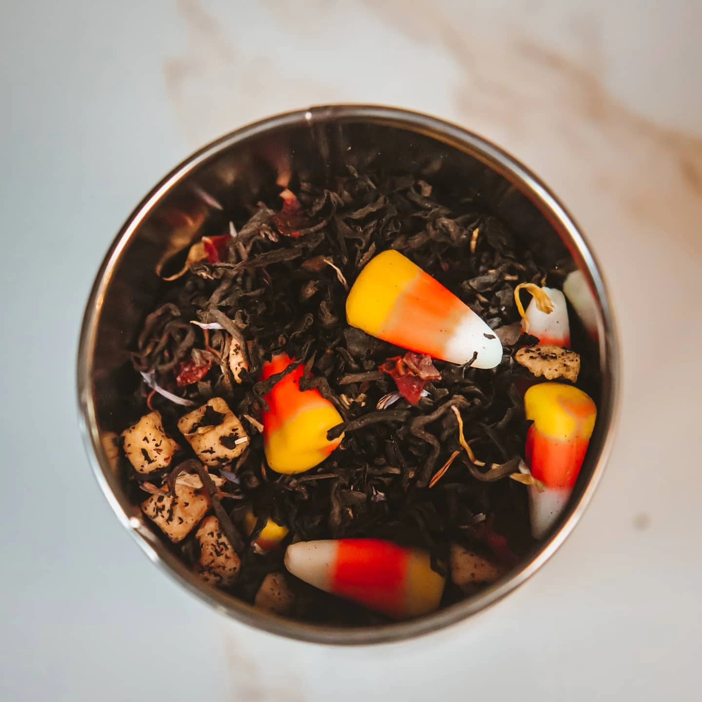 Scarecrow Fall Black tea made with real Candy Corn, apples, oranges, and cinnamon!